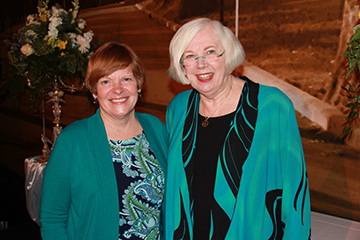 Anne Connolly '80, left, poses with President Carol Ann Mooney after receiving her award.